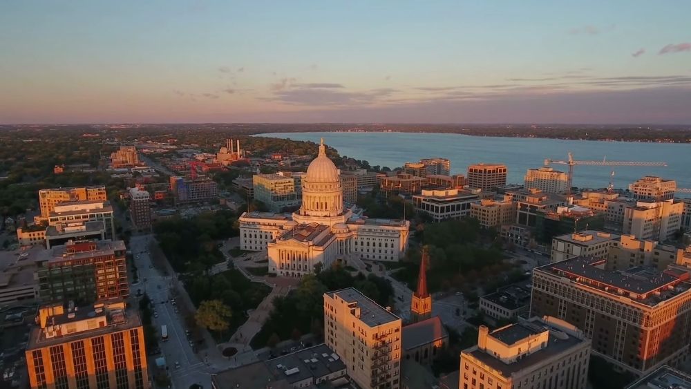 Aerial view of the Wisconsin State Capitol in Madison at sunset near Lake Monona